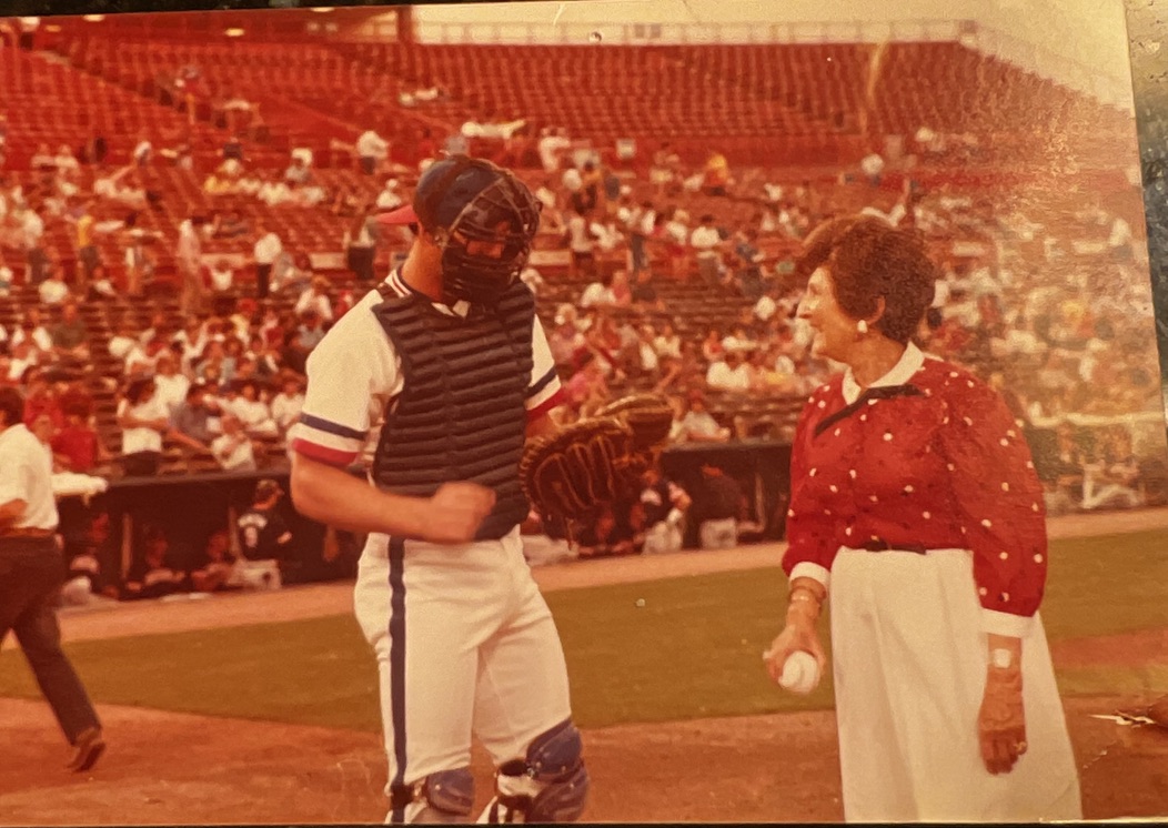 Andrew's late grandmother throwing a ceremonial pitch at a Texas Rangers game when the family sponsored a game.