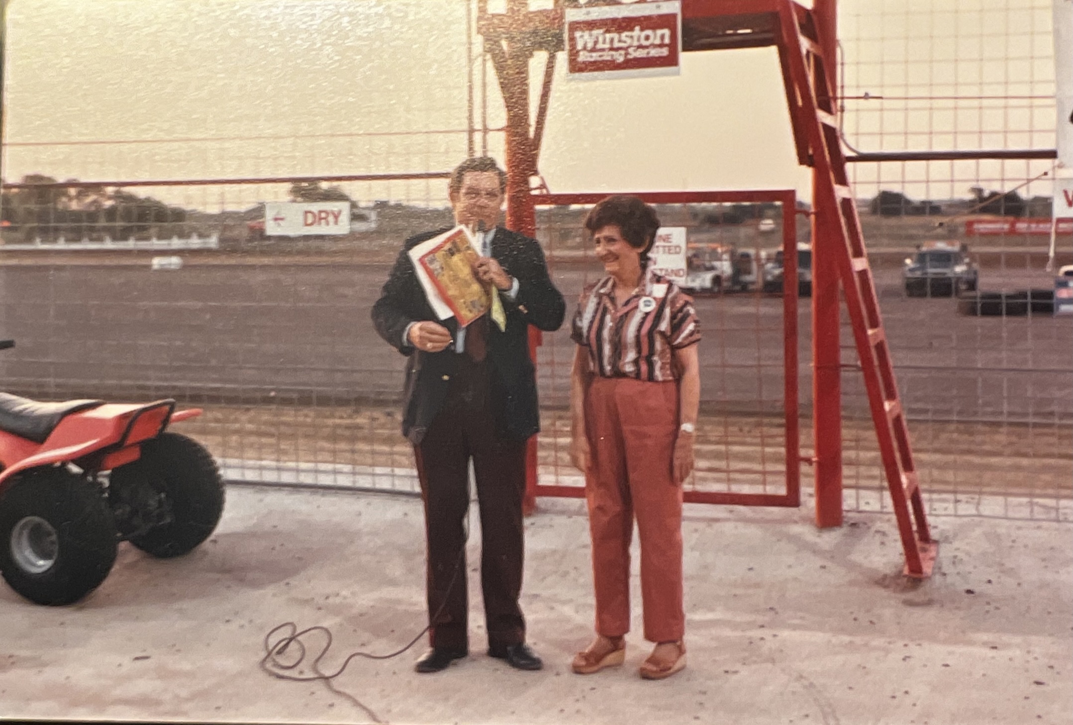 His late grandmother waving the flag to start the car races at Royce City.