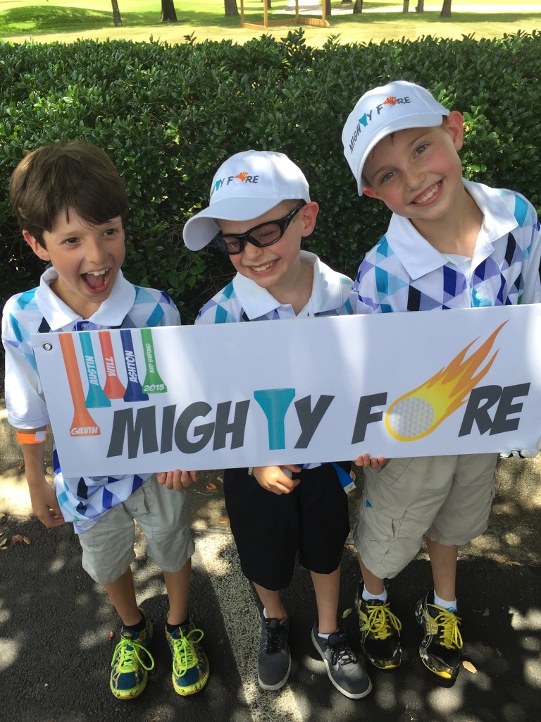 Andrew Hillman. Mighty Fore banner at KidSwing 2015. Tees named Gavin, Austin, Will, and Ashton.