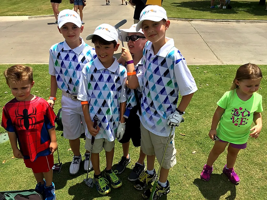 Andrew Hillman Dallas. Mighty Fore team at KidSwing. Matching Mighty Fore polos and hats.