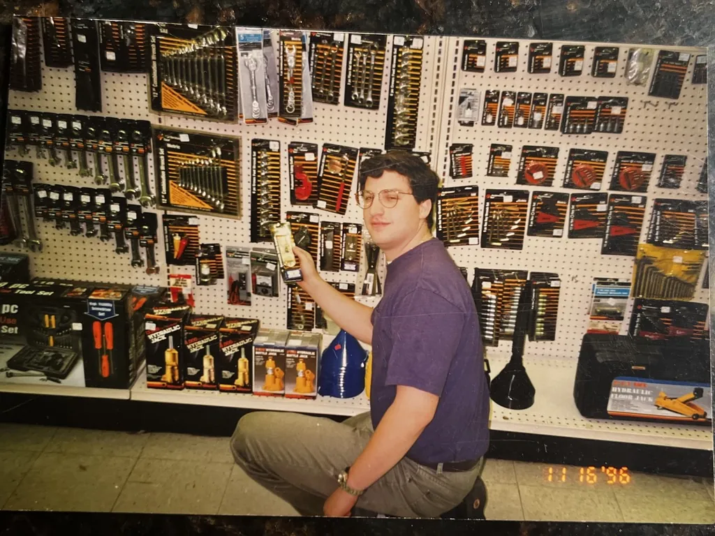 Andrew Jonathan Hillman. Andrew stocking shelves at Midway Auto Supply. Date stamp November 16, 1996.
