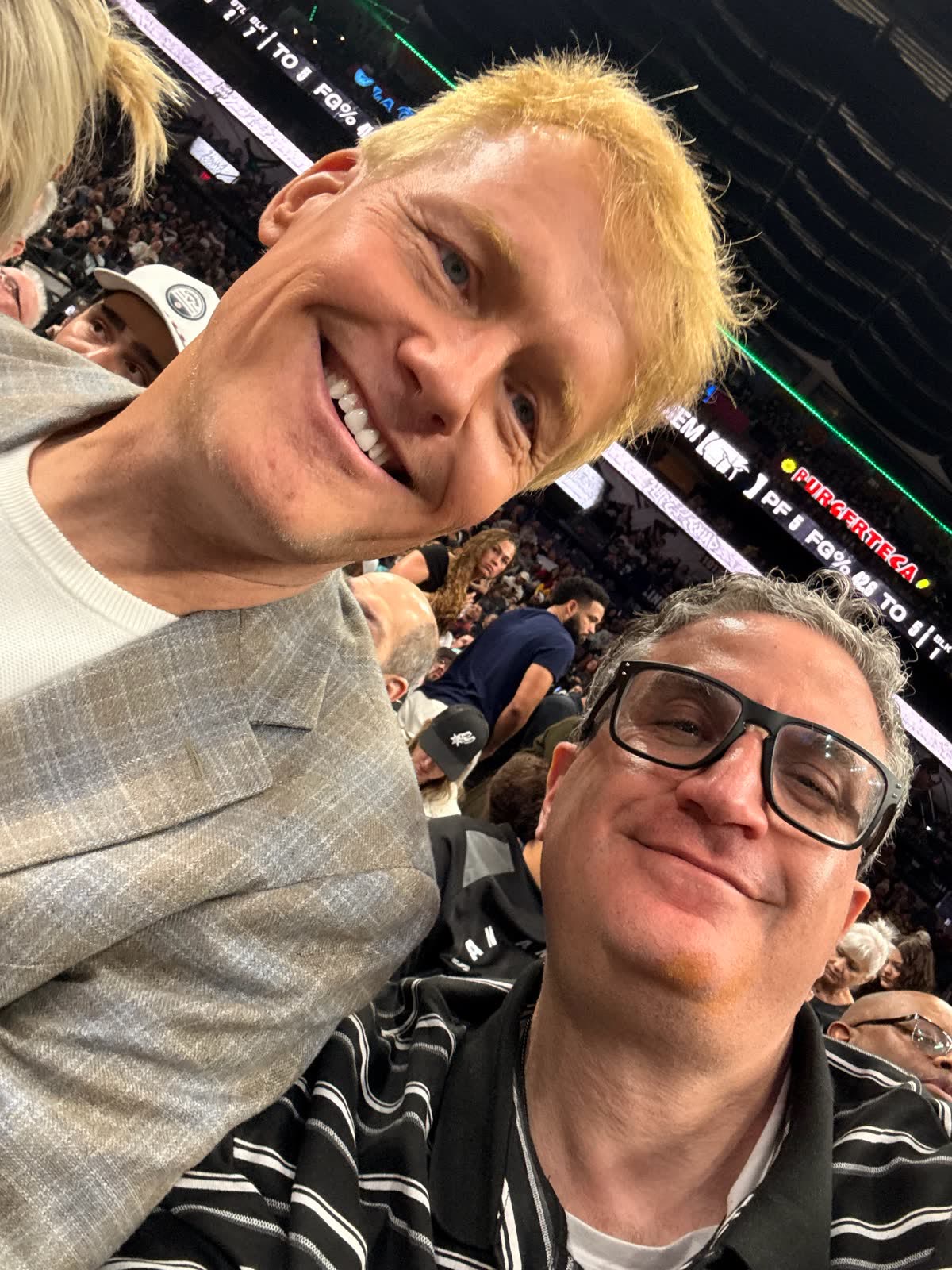 Andrew Hillman with others at a San Antonio Spurs game.