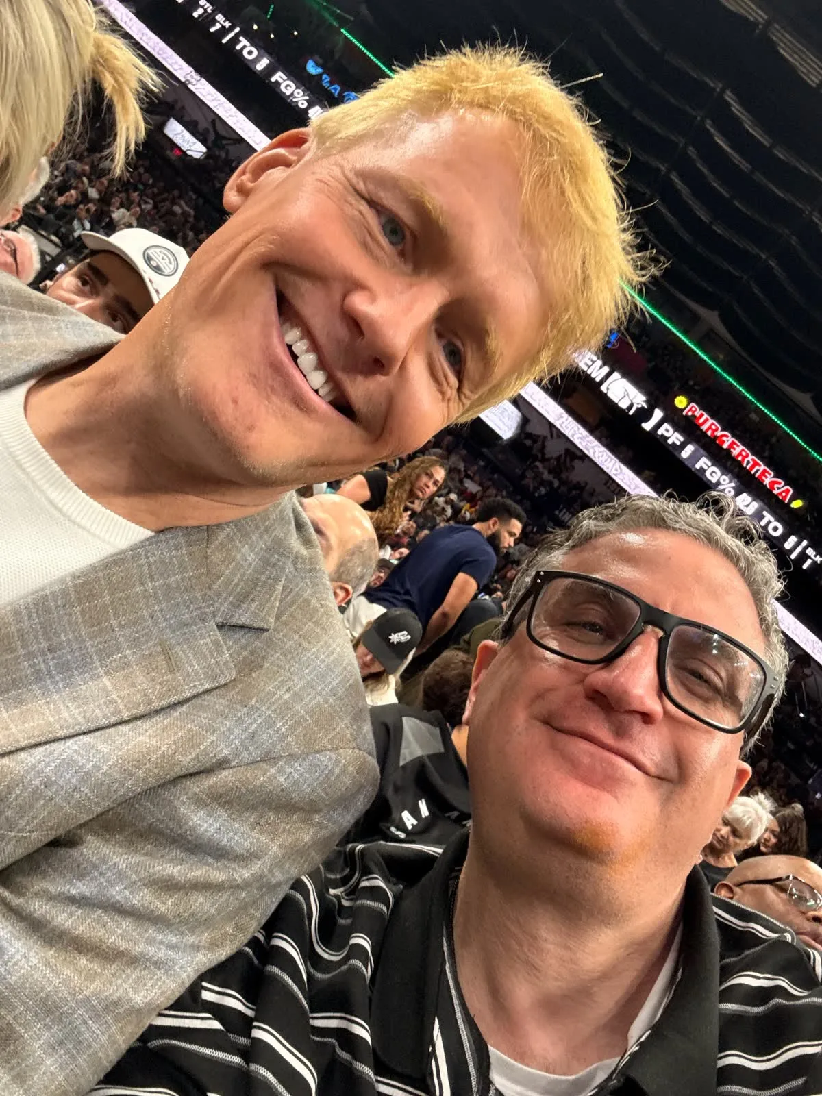 Andrew J. Hillman with others at a San Antonio Spurs game.