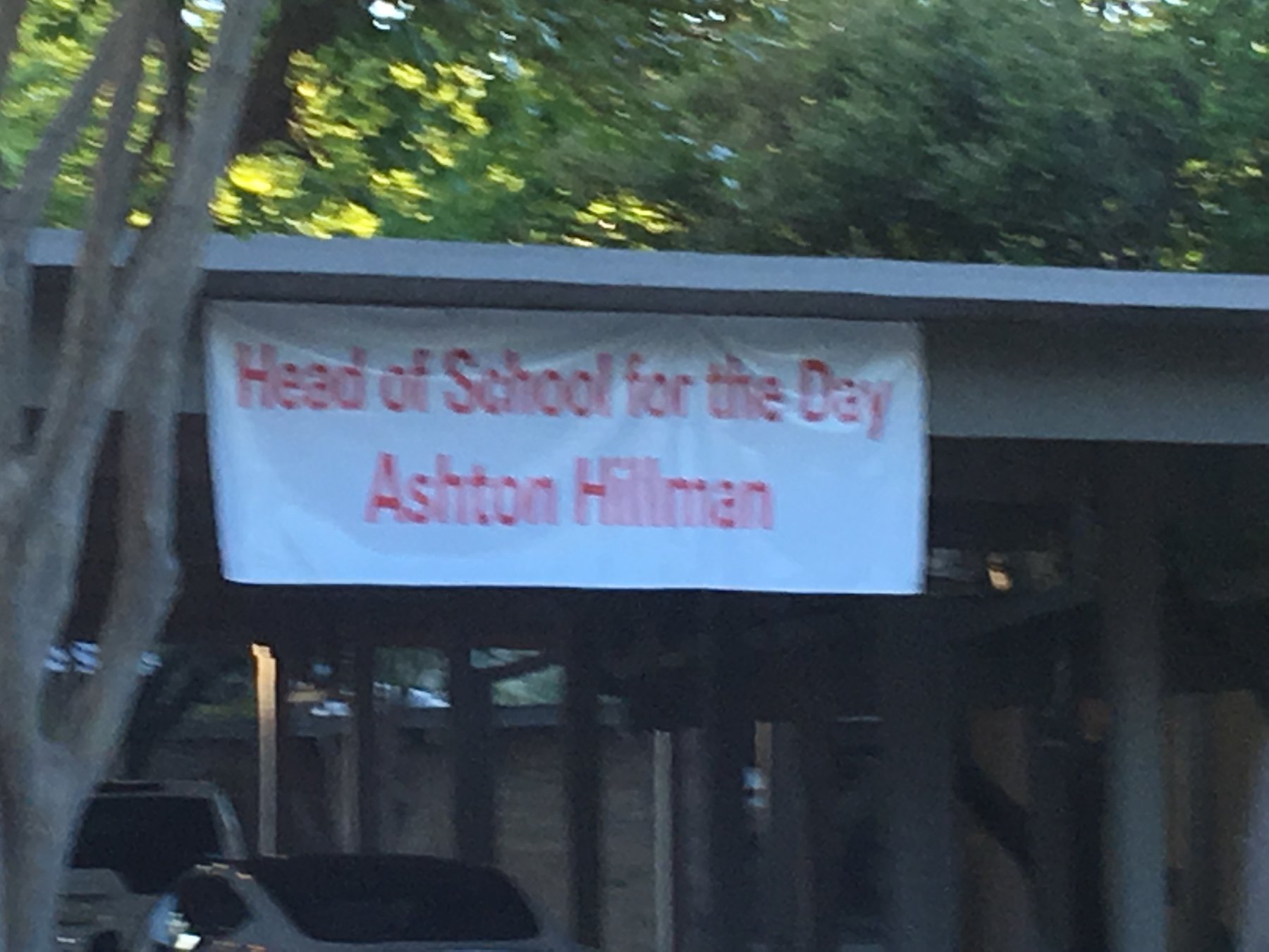 Andrew Hillman. Banner reading Head of School for the Day, Ashton Hillman, at The Lamplighter School.
