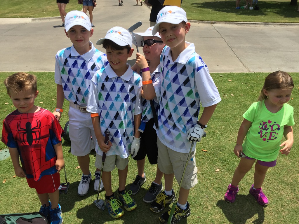 Mighty Fore team at KidSwing. Matching Mighty Fore polos and hats.