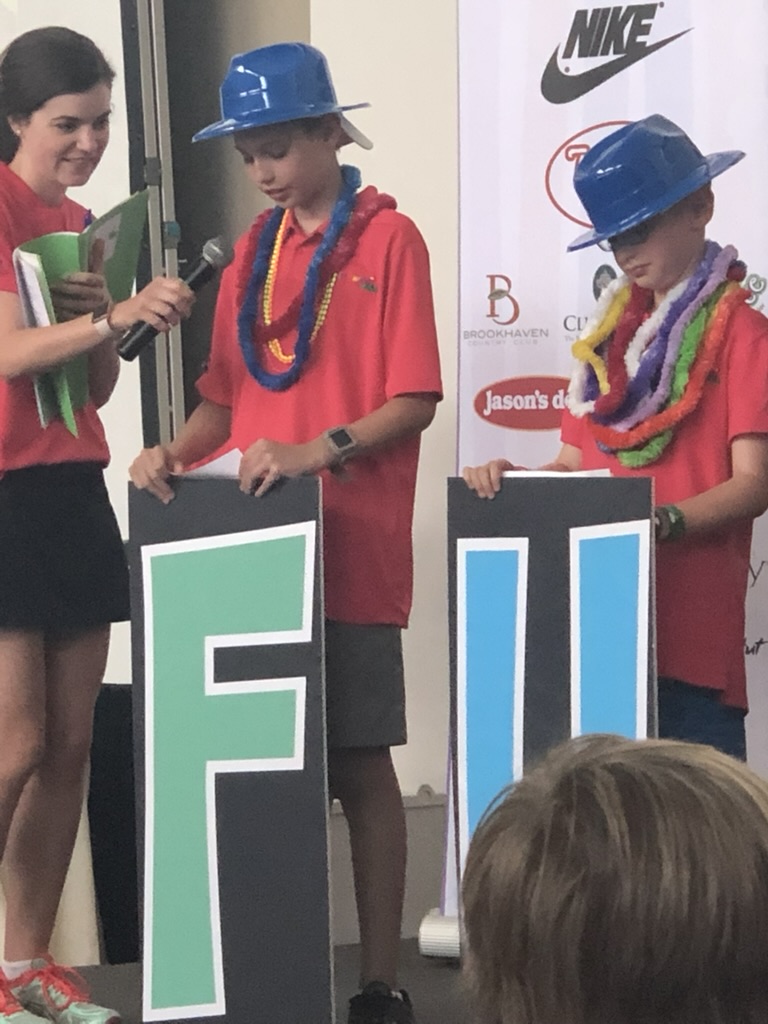 KidSwing stage. Letter signs and in-kind sponsors.