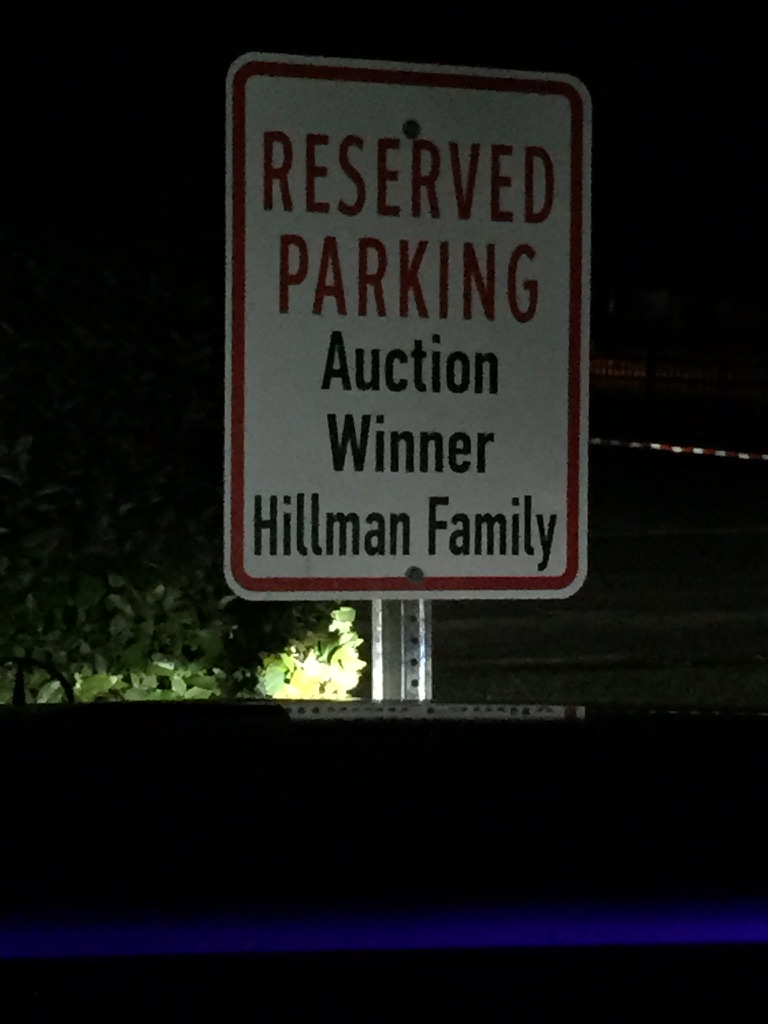 Reserved parking sign at The Lamplighter School reading Auction Winner, Hillman Family