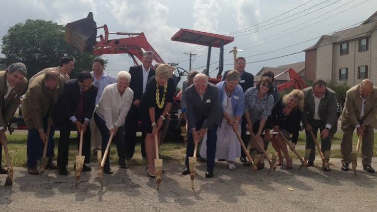 Groundbreaking at Victory Medical Center, a group with ceremonial shovels