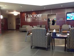 Victory Medical Center lobby with Victory Medical Center Mid Cities wall sign